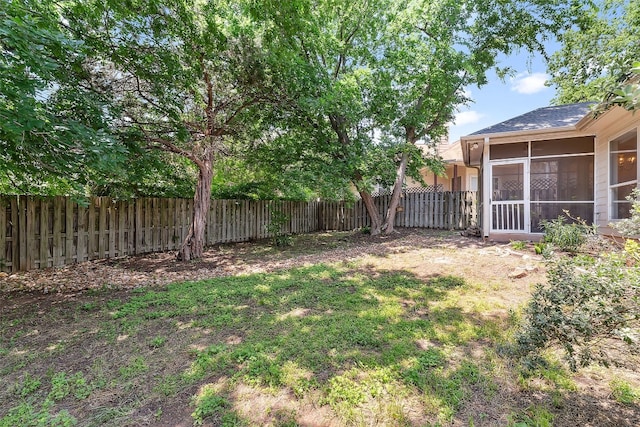 view of yard featuring a sunroom