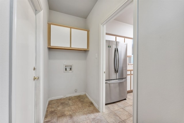 laundry room featuring cabinets and washer hookup