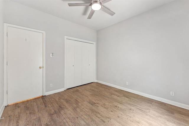 unfurnished bedroom featuring ceiling fan and wood-type flooring