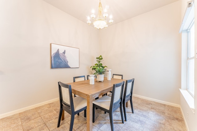 dining room with a notable chandelier