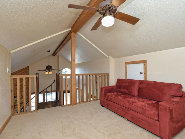 living room featuring carpet flooring, vaulted ceiling with beams, and ceiling fan