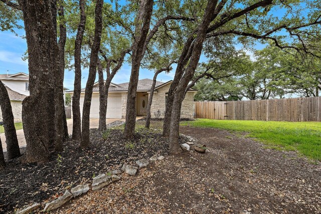 view of yard with a garage