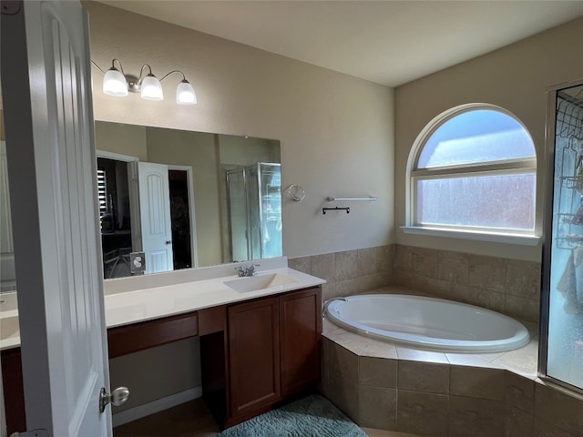 bathroom featuring vanity and plus walk in shower