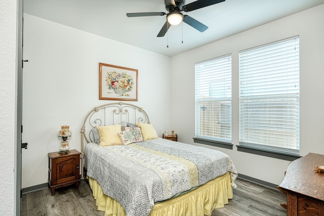 bedroom with ceiling fan and wood-type flooring