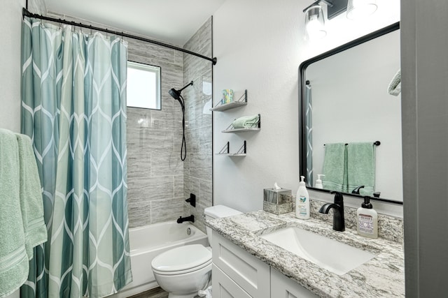 full bathroom featuring toilet, vanity, and shower / bathtub combination with curtain