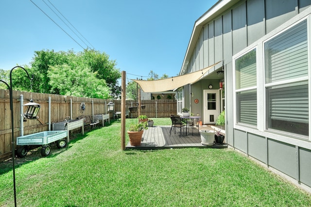 view of yard with a wooden deck