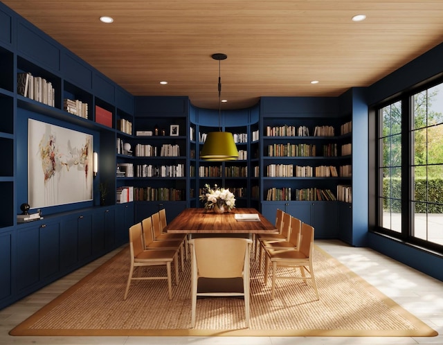 living area featuring light hardwood / wood-style flooring, wooden ceiling, and built in shelves