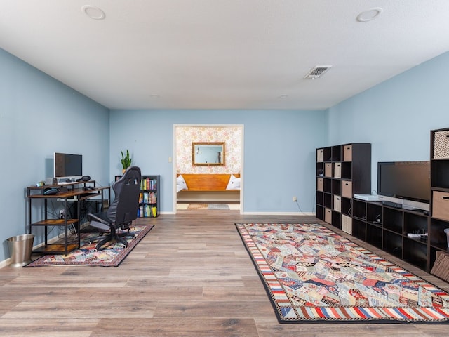 office space with light hardwood / wood-style flooring