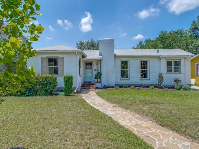 ranch-style home with a front yard