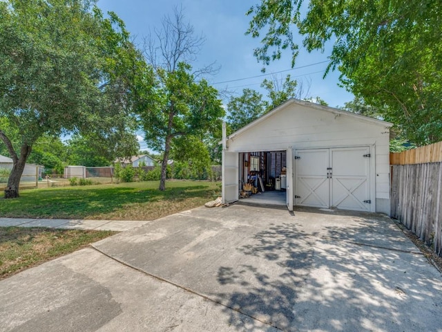 garage featuring a yard