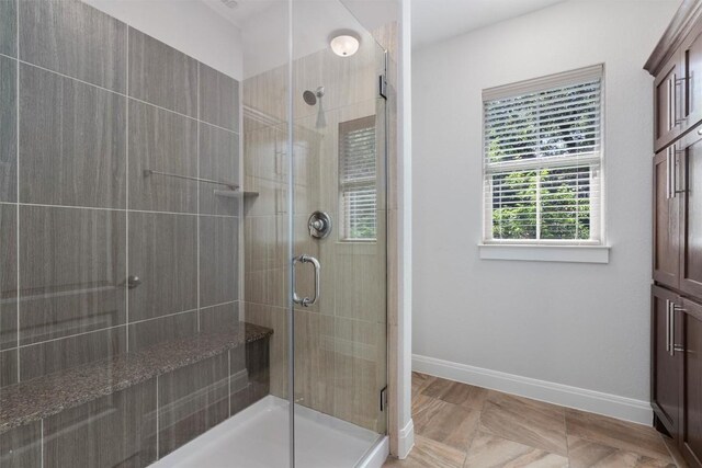13909 Yellow Bell Bnd, Austin, TX 78738 - full bath with a stall shower and baseboards