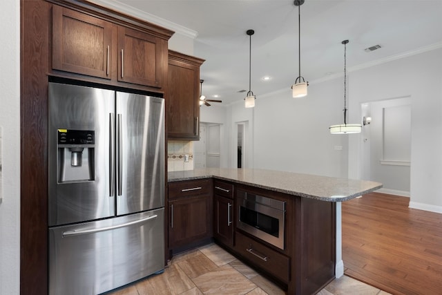 kitchen featuring light hardwood / wood-style flooring, ceiling fan, stainless steel fridge, light stone countertops, and built in microwave