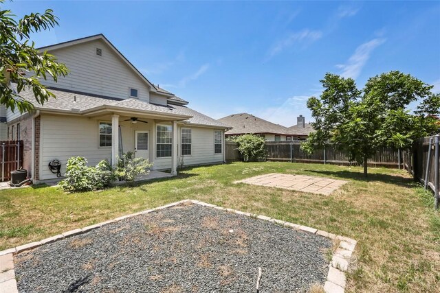 view of yard with a patio and ceiling fan