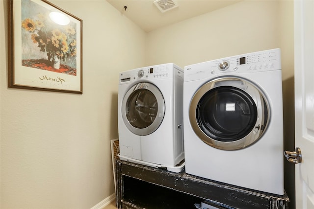 laundry area with independent washer and dryer