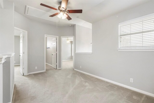 carpeted empty room featuring ceiling fan