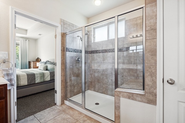 bathroom with tile patterned flooring and a shower with shower door