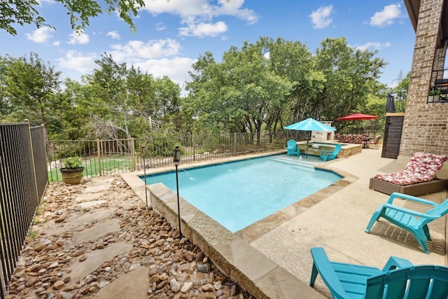 view of swimming pool featuring a patio and pool water feature