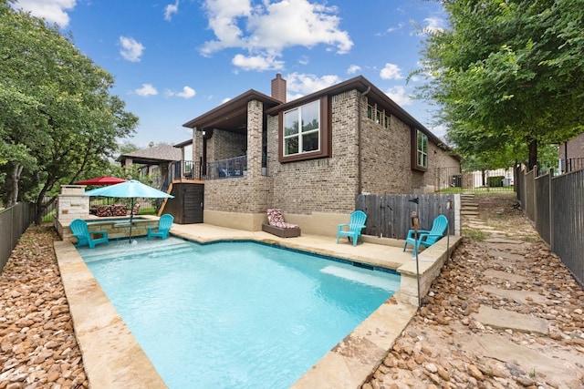 view of pool with a patio