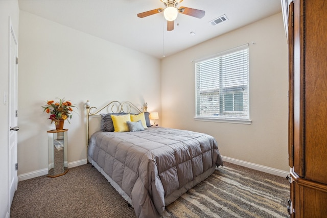 bedroom featuring ceiling fan and dark colored carpet