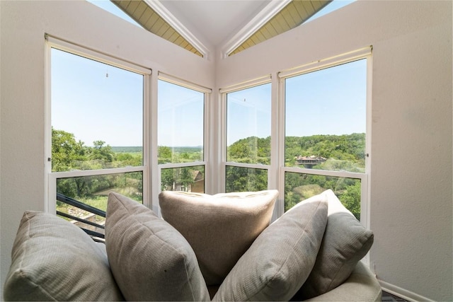 sunroom featuring lofted ceiling