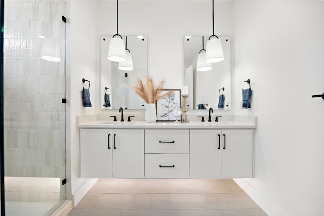 bathroom featuring tile patterned flooring, vanity, and an enclosed shower