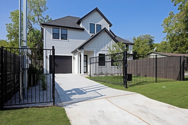 view of front of house featuring a front yard and a garage