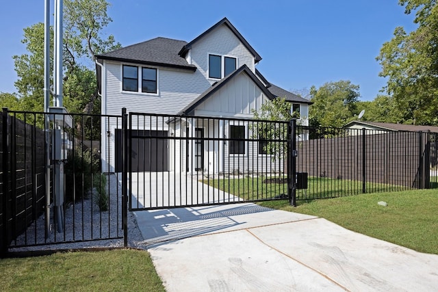 view of gate with a lawn