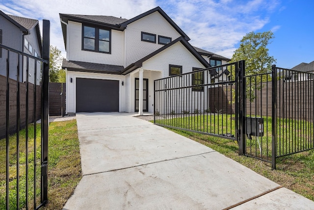 view of front of house with a garage and a front lawn