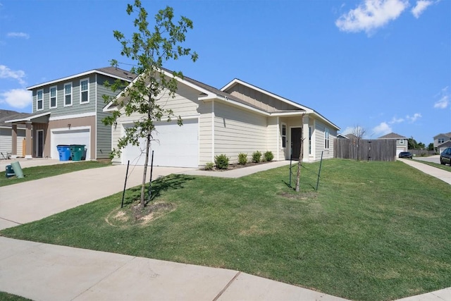 view of front of property featuring a front yard and a garage