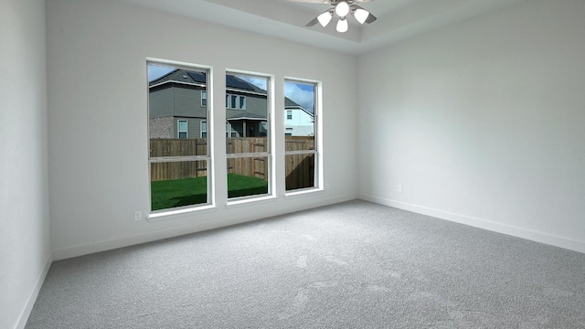 empty room featuring carpet and ceiling fan