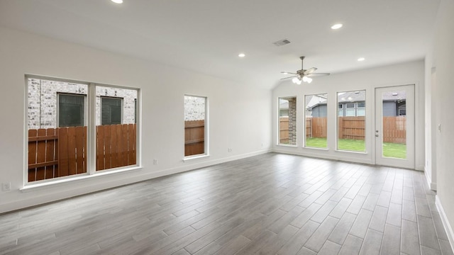 empty room with ceiling fan and wood-type flooring