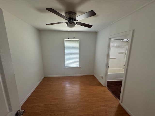 spare room with ceiling fan and hardwood / wood-style floors