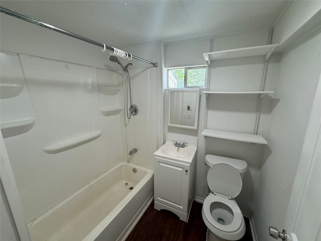 full bathroom featuring large vanity, toilet, hardwood / wood-style flooring, and tub / shower combination