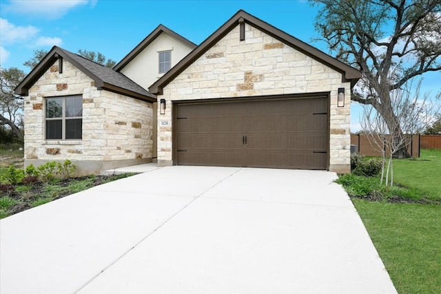 view of front of house featuring a front yard and a garage