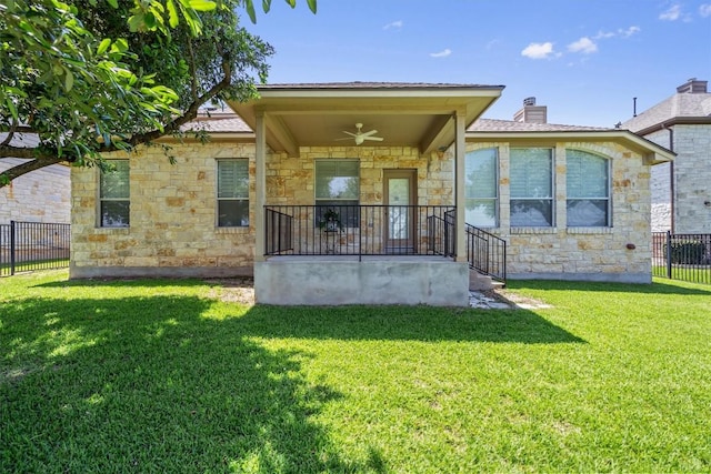 1102 Winding Creek Pl, Round Rock, TX 78665 - back of house featuring a ceiling fan, a chimney, fence, a yard, and stone siding