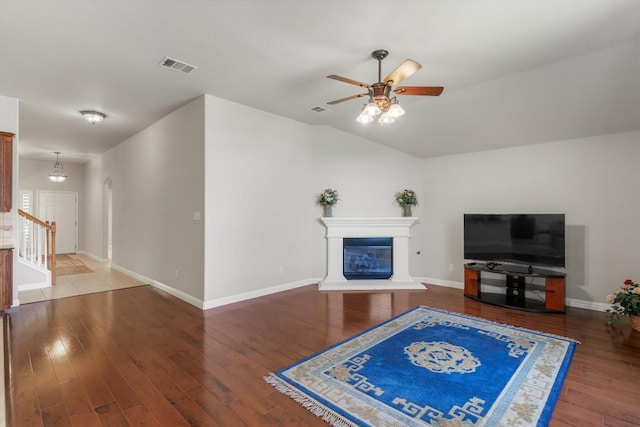 unfurnished living room with ceiling fan and wood-type flooring