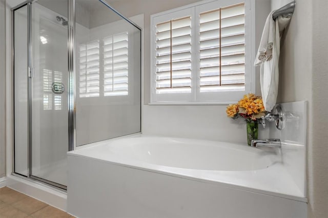 bathroom featuring tile patterned floors and plus walk in shower