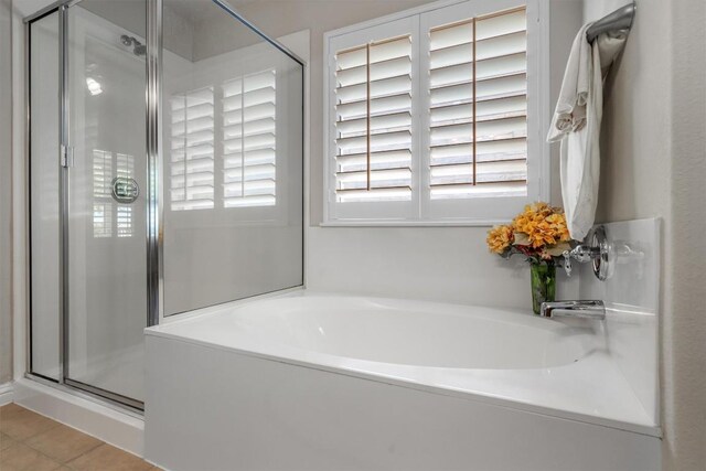 1102 Winding Creek Pl, Round Rock, TX 78665 - bathroom featuring a shower stall, a garden tub, and tile patterned flooring