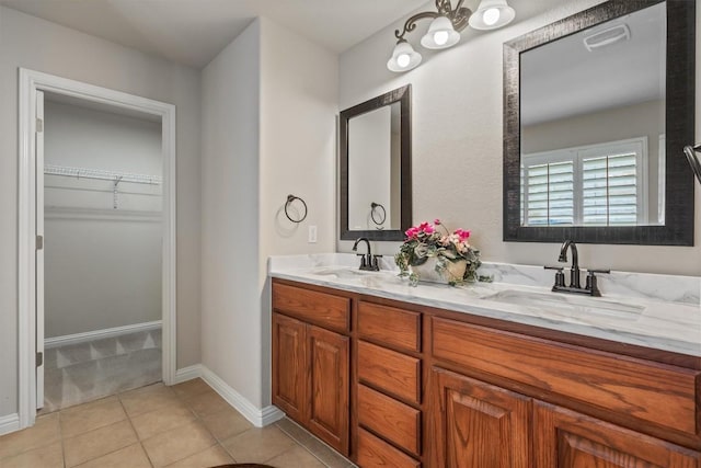 1102 Winding Creek Pl, Round Rock, TX 78665 - full bath with a spacious closet, tile patterned floors, a sink, and double vanity