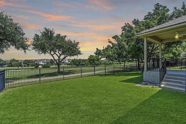 1102 Winding Creek Pl, Round Rock, TX 78665 - yard at dusk with fence and a ceiling fan