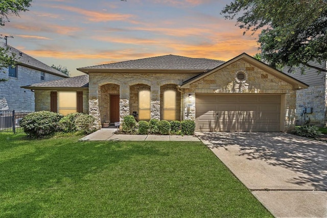 1102 Winding Creek Pl, Round Rock, TX 78665 - view of front of home with stone siding, a garage, a front yard, and concrete driveway