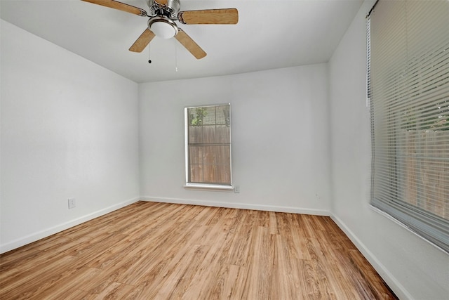 spare room with ceiling fan and light hardwood / wood-style flooring