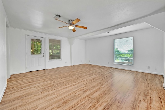 unfurnished room with ceiling fan and light wood-type flooring