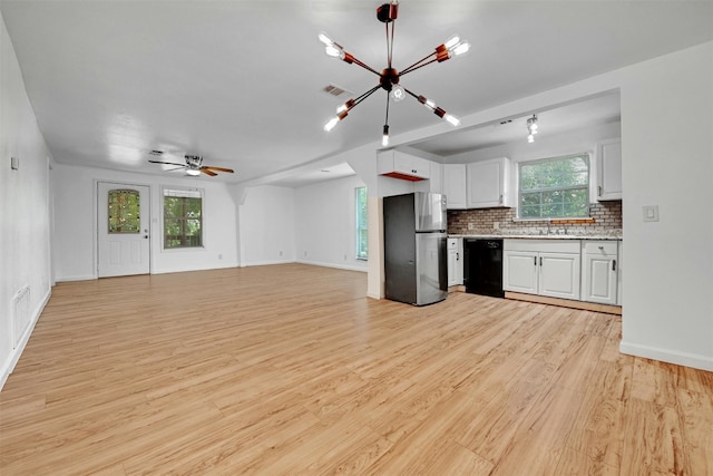 kitchen featuring stainless steel fridge, dishwasher, white cabinetry, backsplash, and light wood-type flooring