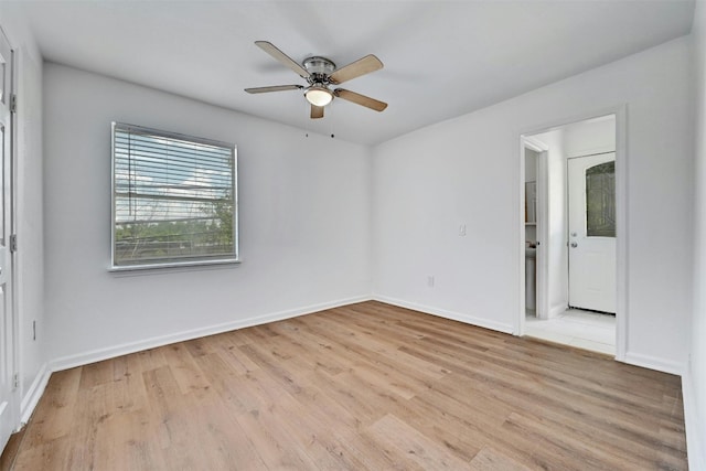 spare room featuring light hardwood / wood-style flooring and ceiling fan