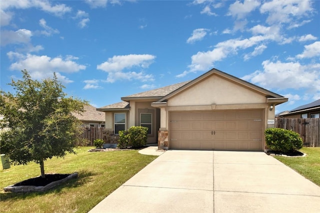 single story home with a garage and a front lawn