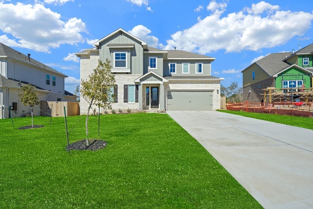 craftsman-style house with a garage and a front lawn