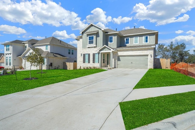 view of front facade with a garage and a front lawn