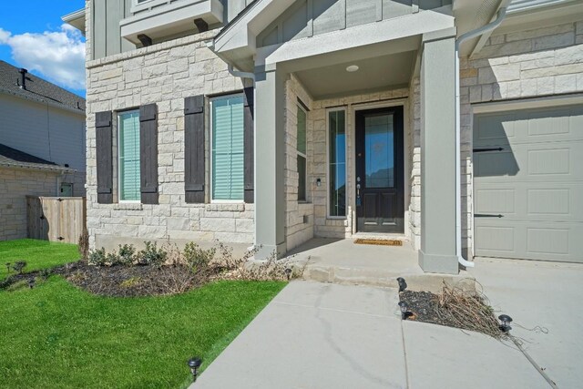 doorway to property featuring a garage