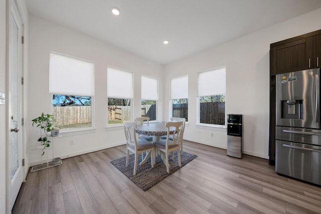 dining space featuring light wood-type flooring